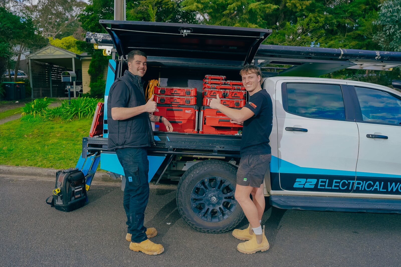 Josh Povey and Lachy loading up the 22 Electrical Works ute